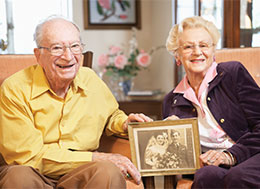 Photo of a couple smiling. 