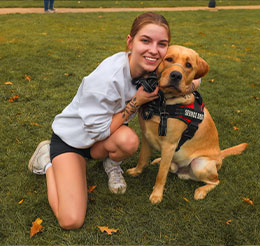 Photo of a woman with a dog. Link to What to Give.